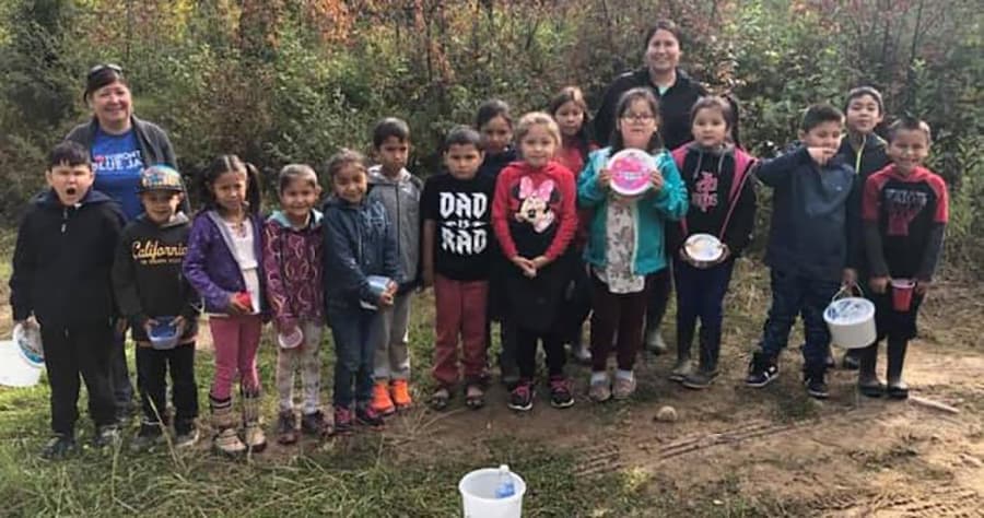Buffalo River School students and a teacher gathered outdoors in the fall