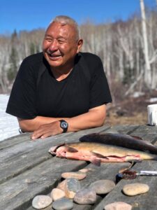 Indigenous man with fish